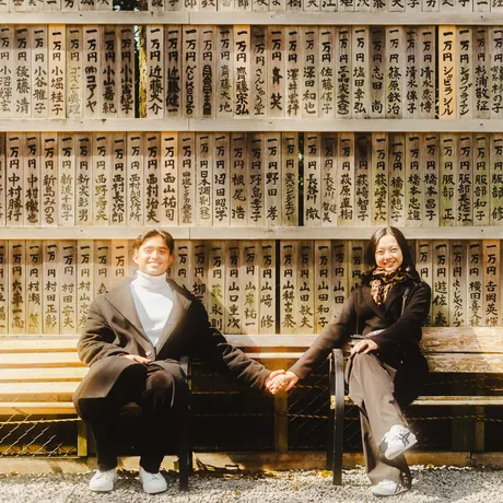 Priam and Eden sitting together on a bench